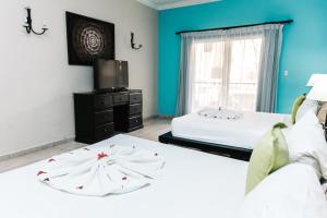 Postel nebo postele na pokoji v ubytování Hotel Brisa