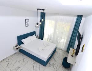 Postel nebo postele na pokoji v ubytování Emerald
