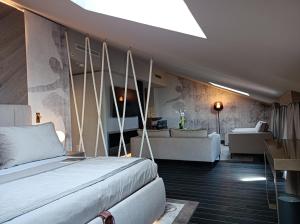 a bedroom with a bed and a living room at Miramare Suites in Sestri Levante