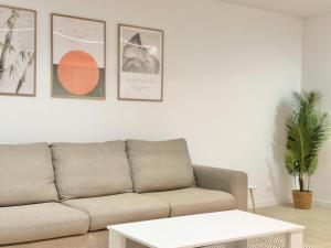 a living room with a couch and a table at House of Art in Arezzo +15 photos