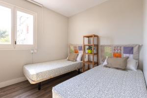 Postel nebo postele na pokoji v ubytování Via Augusta by Unik Tarragona