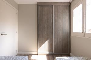 Postel nebo postele na pokoji v ubytování Via Augusta by Unik Tarragona