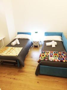 Posteľ alebo postele v izbe v ubytovaní CasaBlanca Apartment