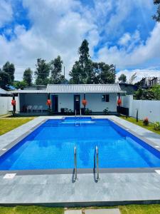 Bazén v ubytování The Windy Mist Resort Munnar nebo v jeho okolí