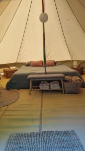 a bedroom with a bed in a tent at B&B Weselo in Mol