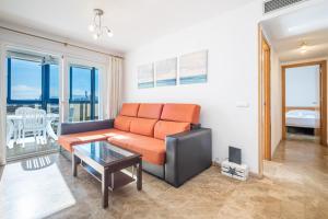 a living room with a couch and a table at Acintur 13-A Apartment Levante Beach-Old Town in Benidorm +29 photos