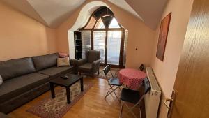 a living room with a couch and a table at D&S Apartment Ohrid in Ohrid
