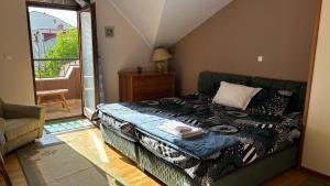 a bedroom with a bed and a sliding glass door at D&S Apartment Ohrid in Ohrid