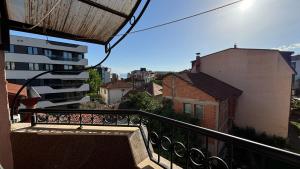 a balcony with a view of a city at D&S Apartment Ohrid in Ohrid