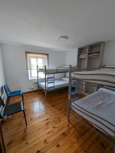 Postel nebo postele na pokoji v ubytování Albergue El Alfar/Pilgrim Hostel