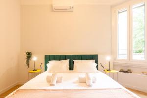 Postel nebo postele na pokoji v ubytování Italianflat - Navigli Suite
