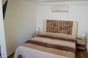Postel nebo postele na pokoji v ubytování Apartmány u Jozefa + 1 fotografie