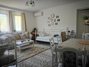 a living room with a couch and a table at Kúria Apartman Budapest with free parking in Budapest