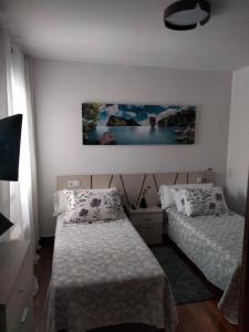 Łóżko lub łóżka w pokoju w obiekcie apartment garden