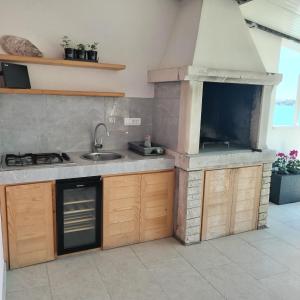 Kuchyňa alebo kuchynka v ubytovaní Apartman La Marija