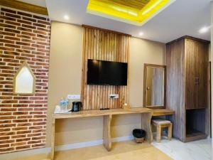 TV a/nebo společenská místnost v ubytování Hotel Matina Suites