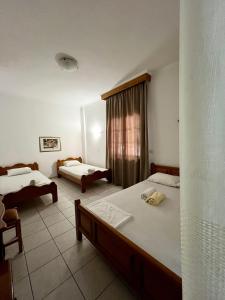 Posteľ alebo postele v izbe v ubytovaní Boufidis Rooms