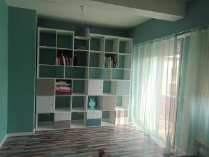 a room with a book shelf and a window at La Lanterne Plage in Nice +2 photos