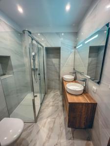 a bathroom with two sinks and a shower at Liviamariasanta in Ajaccio