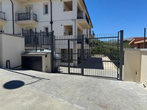 an iron gate in front of a building at MC Rooms in Torretta