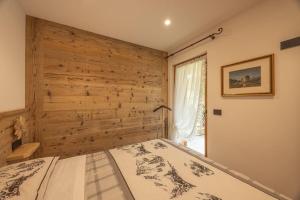 Postel nebo postele na pokoji v ubytování Incantevole appar chalet nuovo