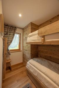 Postel nebo postele na pokoji v ubytování Incantevole appar chalet nuovo