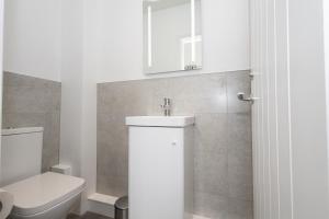 Ένα μπάνιο στο Boutique Bolton Apartments