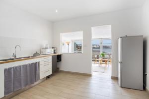 Kuchyň nebo kuchyňský kout v ubytování Beach House el Poris 2