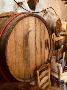 a large wooden barrel sitting next to a chair at Casa Coco No 11 in Polopos