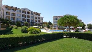 a view of a resort with a lawn and buildings at Sozopol Paradise view in Sozopol