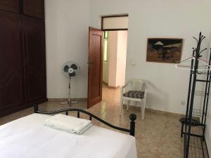 Postel nebo postele na pokoji v ubytování Tarrafal Ecodécor Rooms