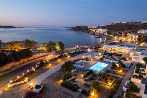 una vista aérea de una ciudad por la noche en Naoussa Hotel Paros by Booking Kottas en Náousa