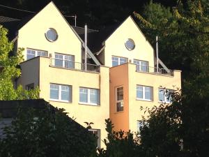 a building with round windows on top of it at Moselschön Das Ferienhaus in Brodenbach