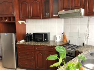 Kuchyň nebo kuchyňský kout v ubytování Tarrafal Ecodécor Rooms