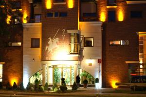 a building with a horse on the front of it at Grot Hotel in Malbork