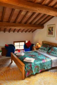A bed or beds in a room at Podere Le Volpaie, Volterra, Tuscany