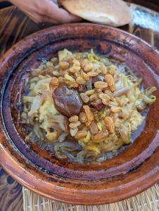 a bowl of food with nuts on top of it at Olas Surf Camp in Imsouane +120 photos