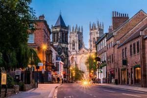 a city street at night with a cathedral at Studio - Sleeps 2 - Pets - Parking - Wifi in York