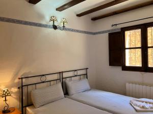 Ένα ή περισσότερα κρεβάτια σε δωμάτιο στο Rincón de la Aldea +83 φωτογραφίες