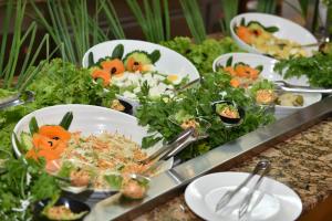 a bunch of plates of food on a table at Villas Ropotamo in Primorsko