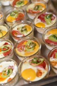 a bunch of small dishes with eggs and peppers at Villas Ropotamo in Primorsko +22 photos