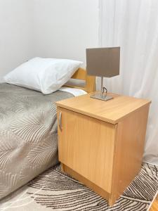 A bed or beds in a room at Light house