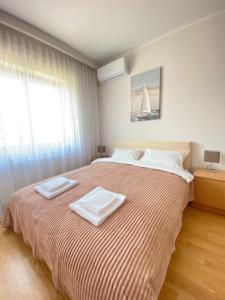 A bed or beds in a room at Light house