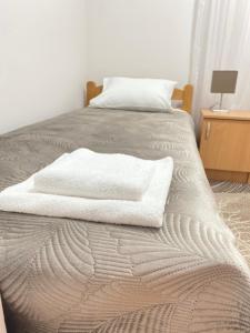 A bed or beds in a room at Light house