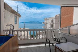 a balcony with a view of the ocean at Esel Apartments in Sarandë