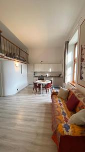 a living room with a couch and a table at Mantellini 2A in Domodossola +7 photos