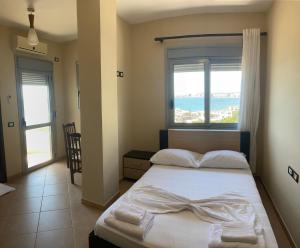 Postel nebo postele na pokoji v ubytování AL Hotel