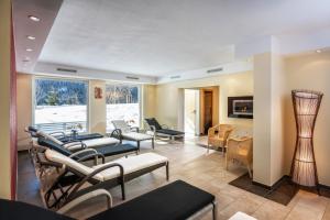 Televízia a/alebo spoločenská miestnosť v ubytovaní Hotel Hammerwirt - Forellenhof