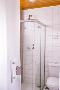 a bathroom with a shower with a toilet at Hotel Primavera Betim in Betim