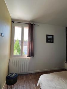 Posteľ alebo postele v izbe v ubytovaní Le chêne fleuri